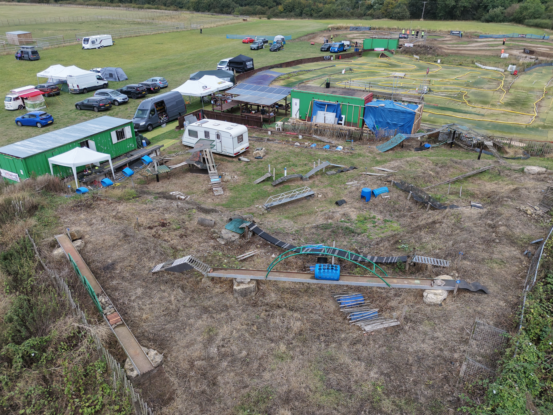 Overview of the crawler course with narrow bridges, timber ramps and rock obstacles, with the astro circuit beyond